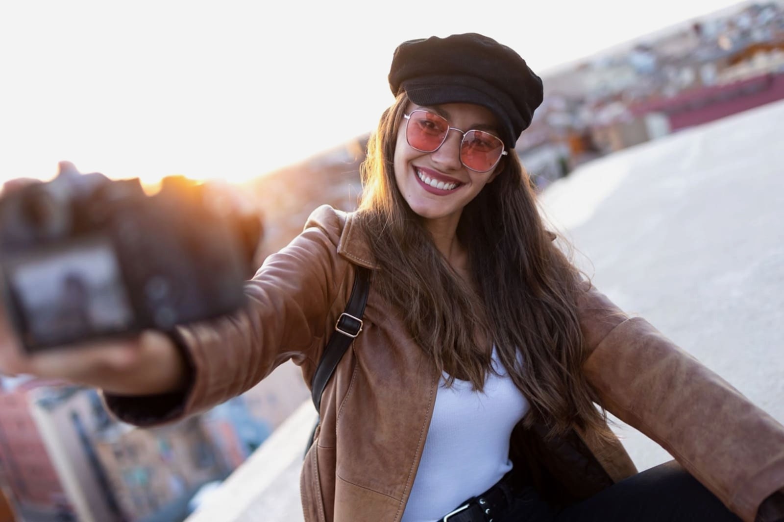 Girl taking a selfie with a DSLR camera